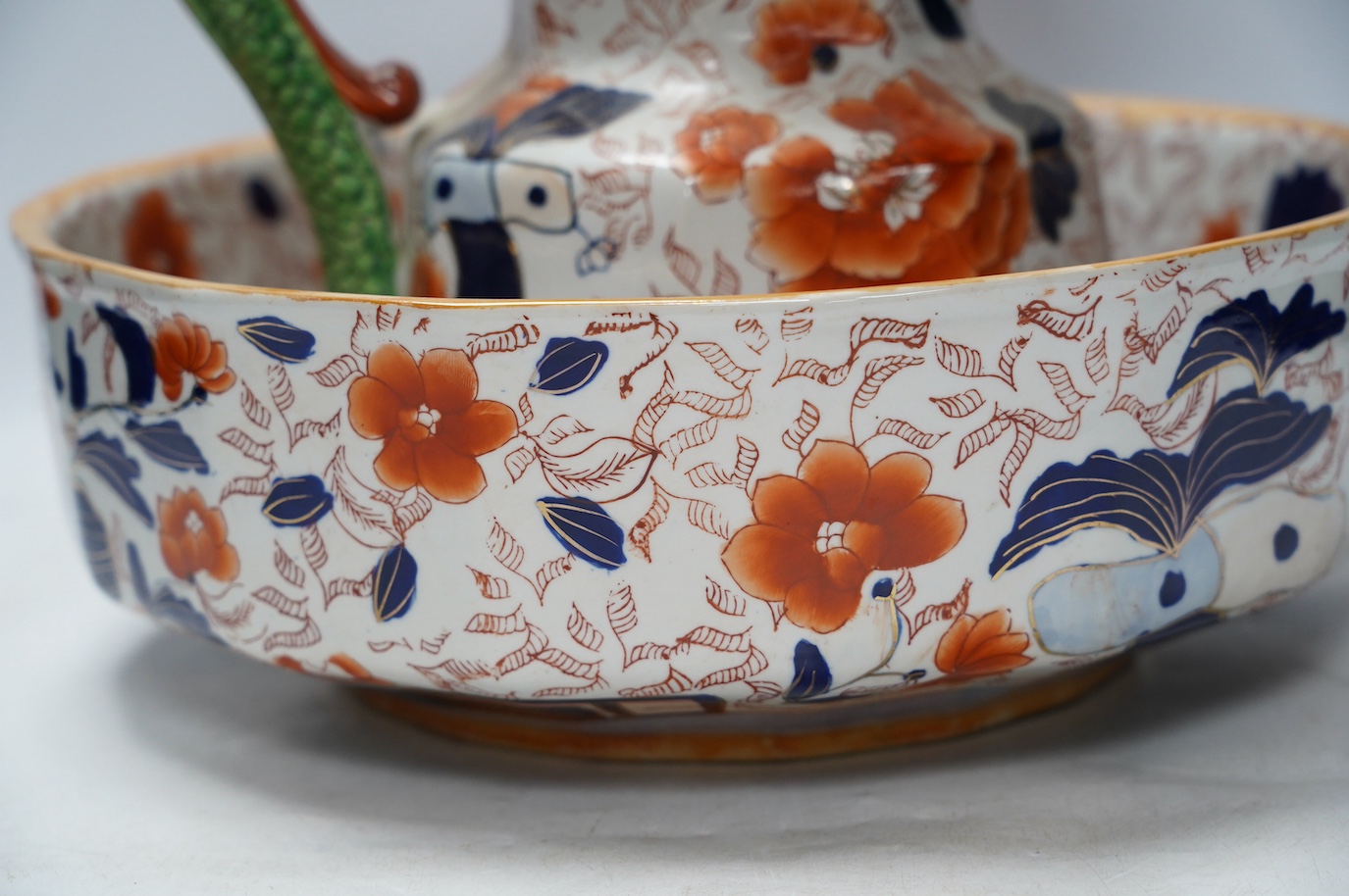 An ironstone style Hydra jug and bowl, together with two Royal Crown Derby dinner plates, jug 28cm high. Condition - poor